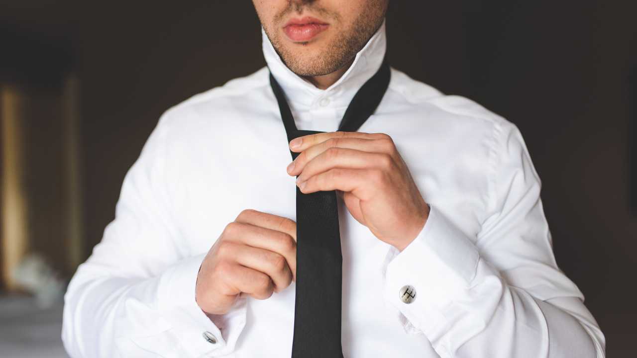 guy wearing tea over a formal work shirt