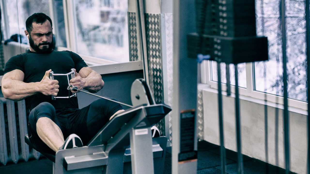 muscular guy working out in gym