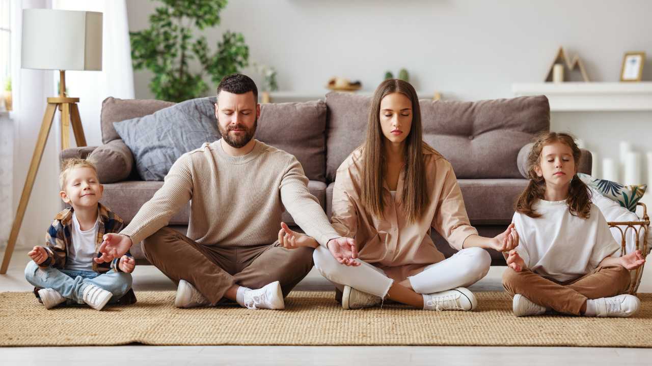 healthy family doing meditation