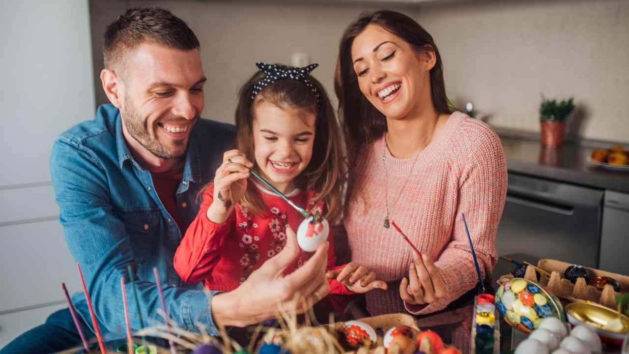 happy family doing easter crafts